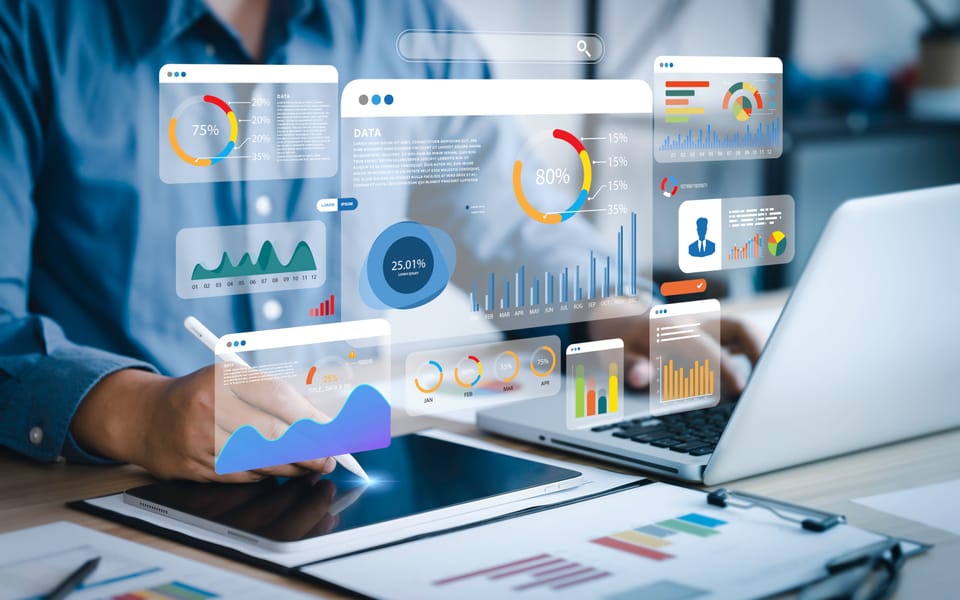 Data scientist analyzing complex data visualizations on multiple screens